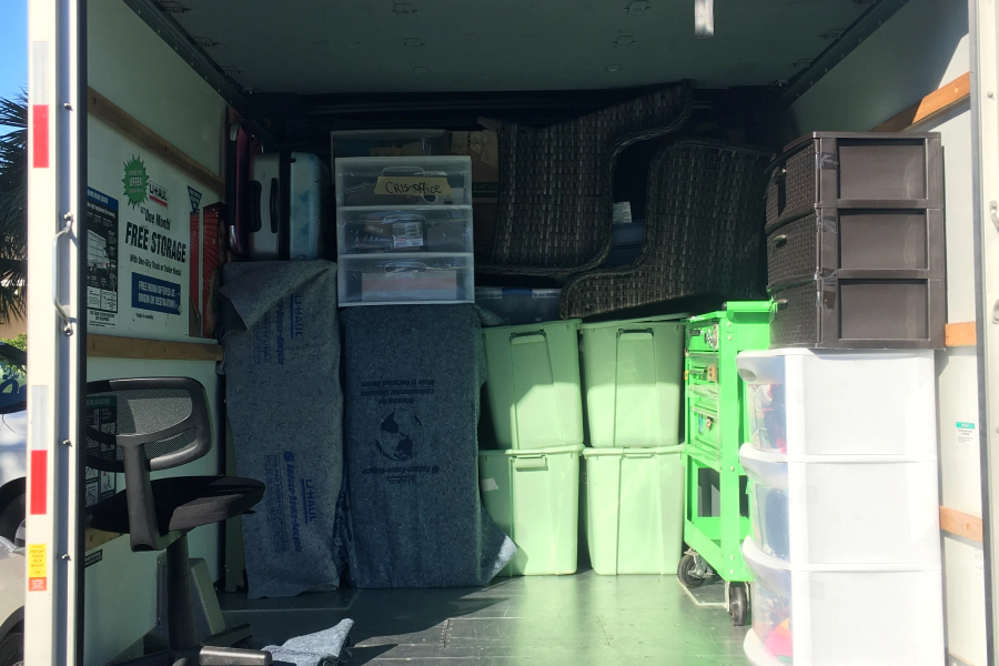 boxes of things in front of a house full service residential